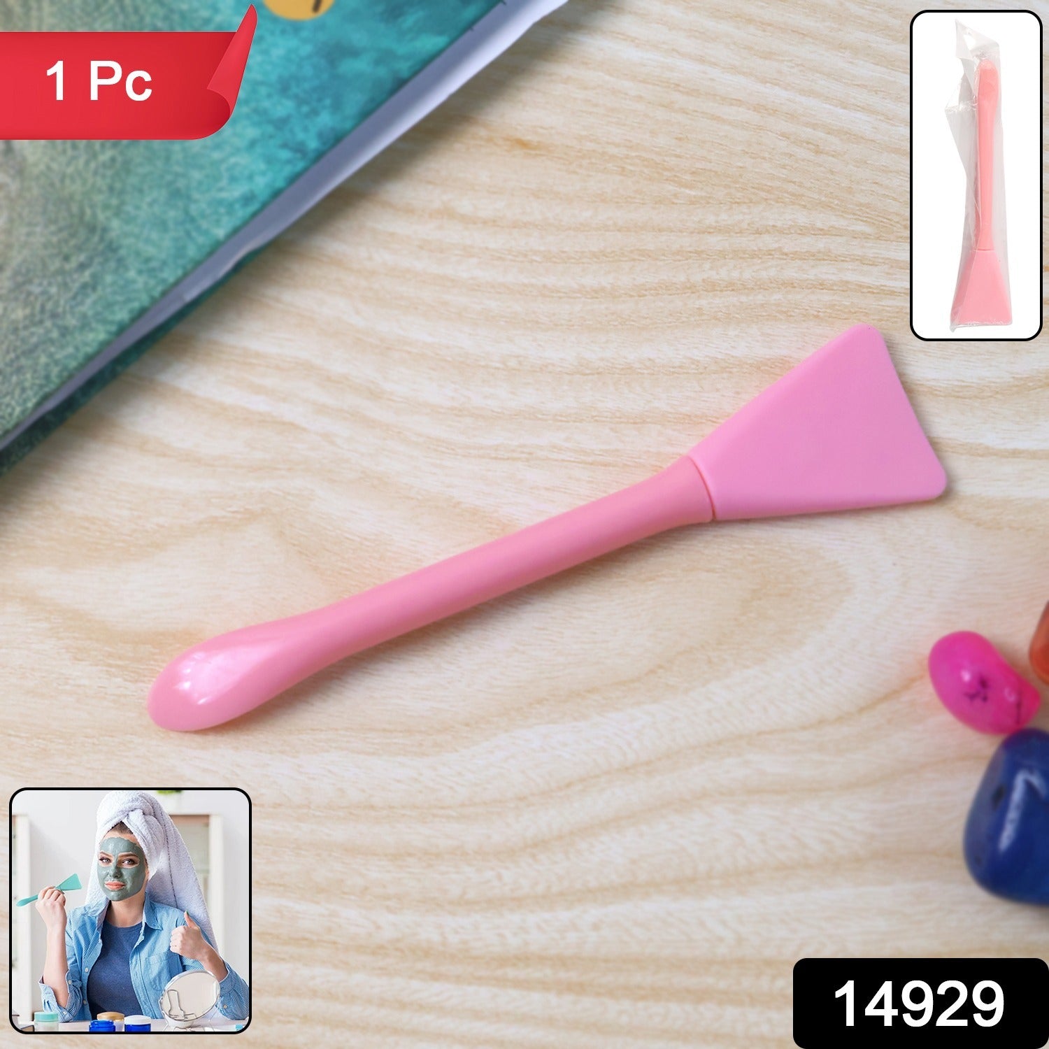 Angled view of flexible facial mask applicator spatula