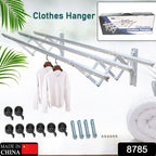 Extended stainless steel drying rack holding towels and clothes, showcasing its capacity.