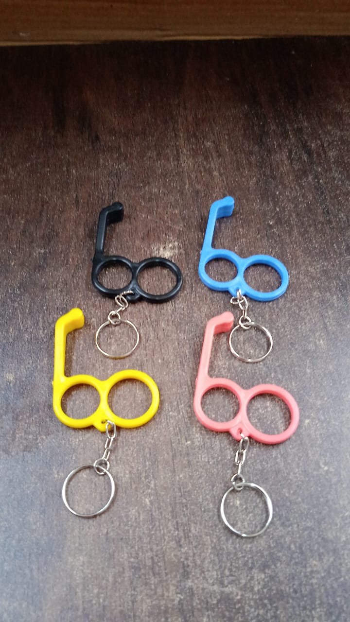 Multi-angle view of dual-finger mobile stand keyring showing sturdy plastic build