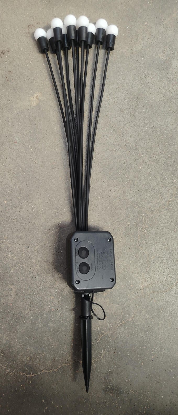 Solar LED fiber optic garden light illuminating outdoor path