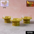Golden water sensor LED diyas glowing in a decorative arrangement.