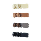 Decorative bow hair clips included in stylish snap clip set