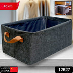 Foldable storage box holding neatly folded clothes, demonstrating practical closet organization.
