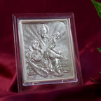 Top-down view of silver Saraswati Maa photo frame highlighting embossed design