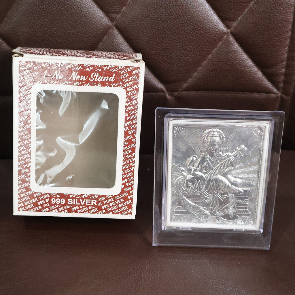 Back view of silver Saraswati Maa photo frame revealing stable stand