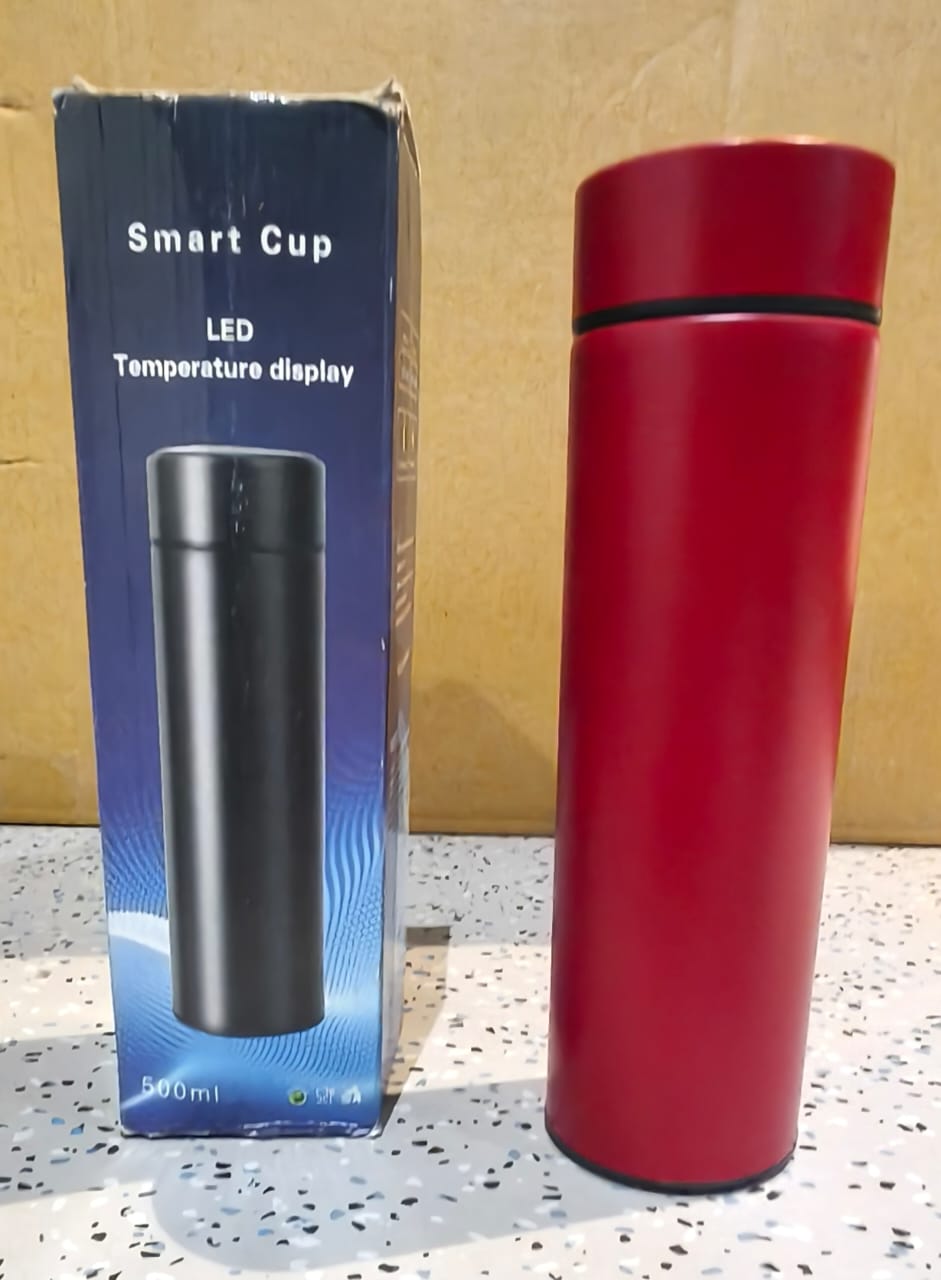 Red smart water bottle in a lifestyle setting for gym or travel use.