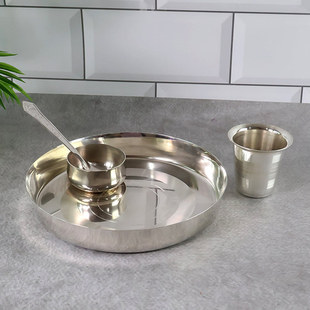 Durable stainless steel round thali plate from the dining set.