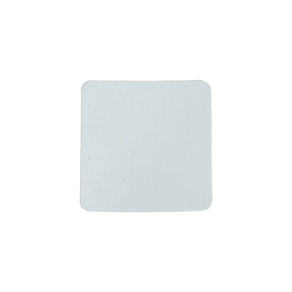 Flat lay of transparent square nano adhesive tape pads