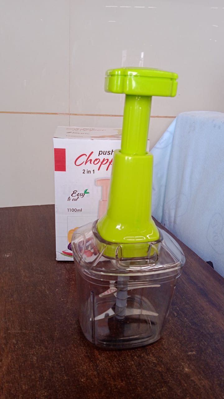 Various fresh vegetables chopped and ready, placed next to the CookAura manual vegetable chopper.