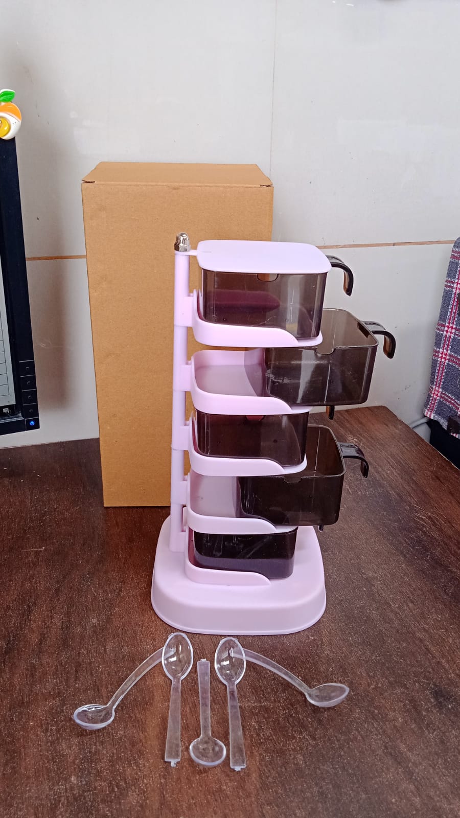 Compact vertical seasoning box, ideal for organizing kitchen spices and condiments.