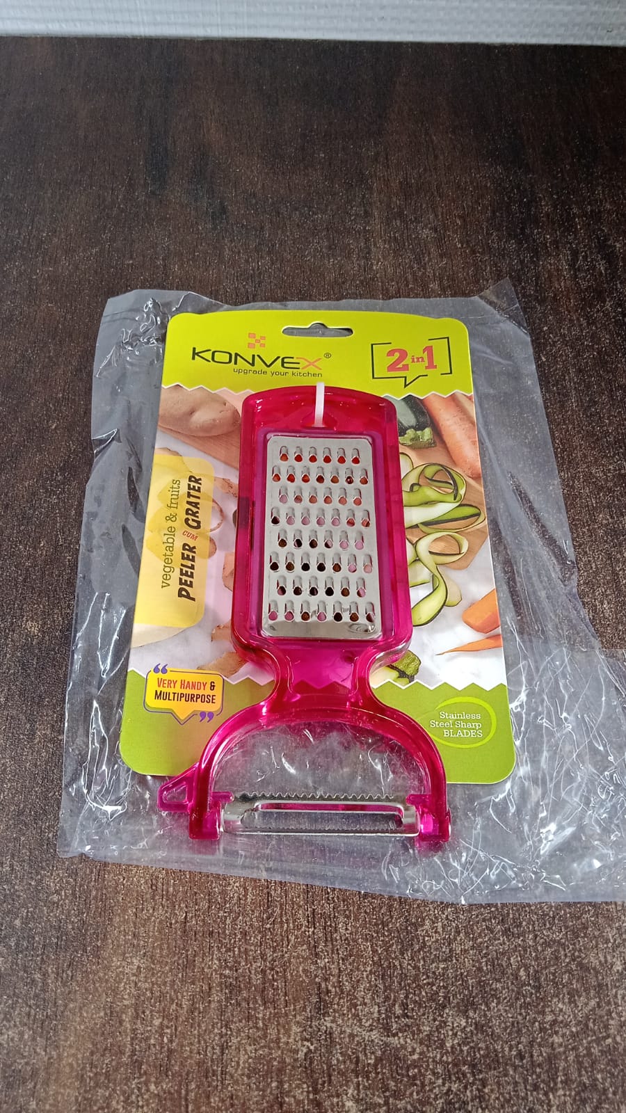Peeling potatoes using the stainless steel 2-in-1 kitchen peeler and grater tool