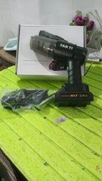 Person using the portable car vacuum cleaner to clean crumbs and debris from car seats.