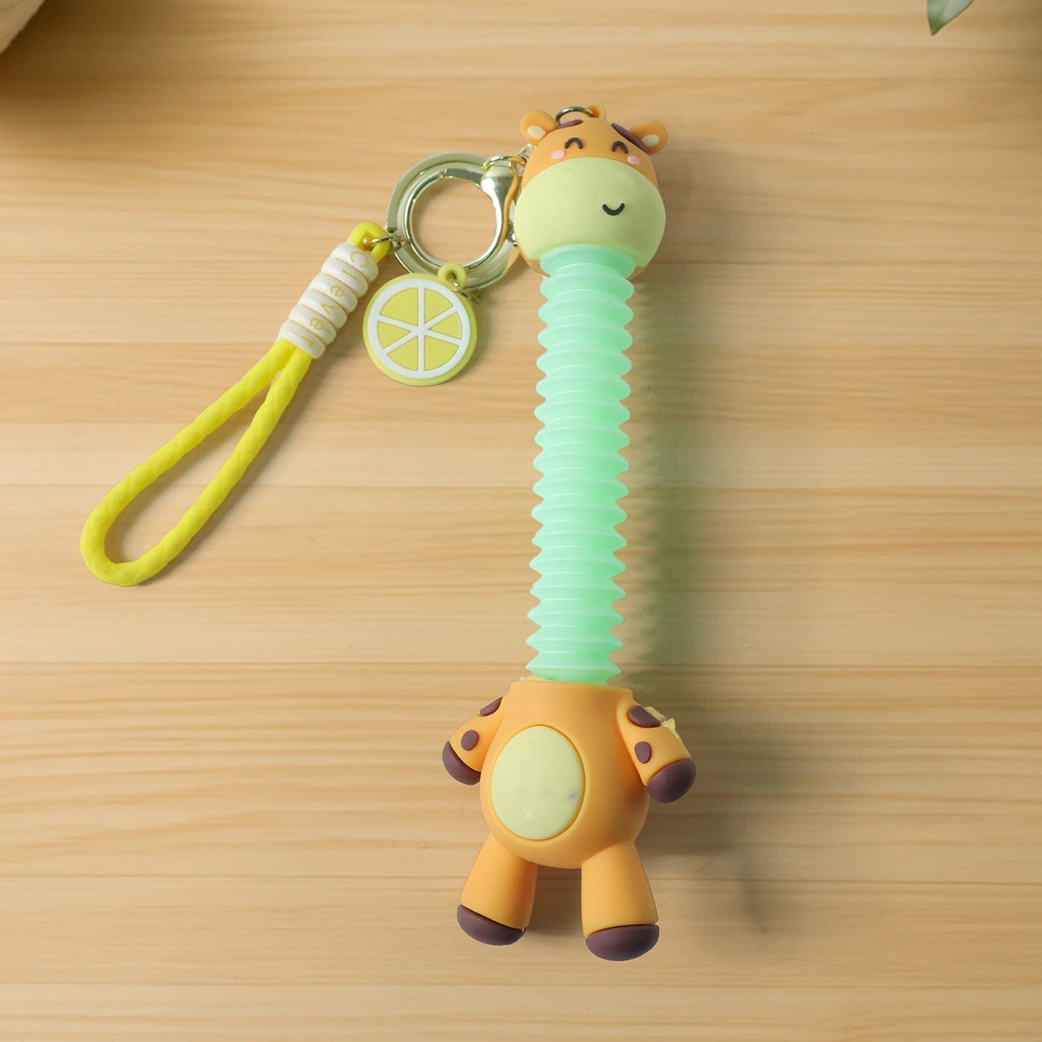 Cute giraffe cartoon keychain featuring flexible neck and strap