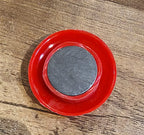 Arrangement of red magnetic buttons on a magnetic office board