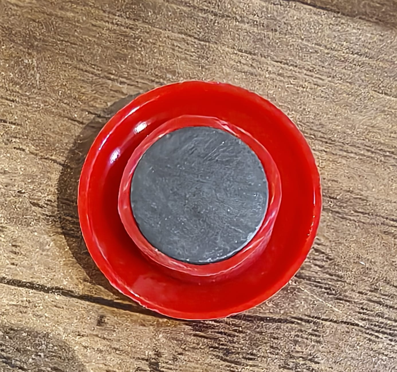 Arrangement of red magnetic buttons on a magnetic office board