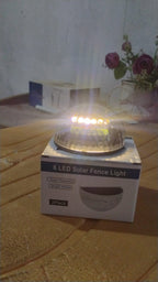 Solar LED wall mount fence light attached on outdoor wall