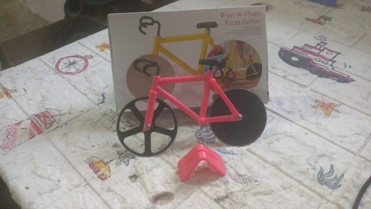 The complete Quickslice Bicycle Pizza Cutter showcasing its innovative design.
