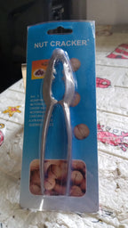 Stainless steel nut cracker shown with its packaging, perfect for gifting.