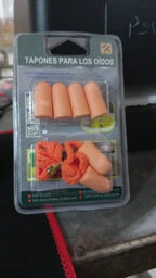 Comfortable soft foam earplugs displayed on a wooden table.
