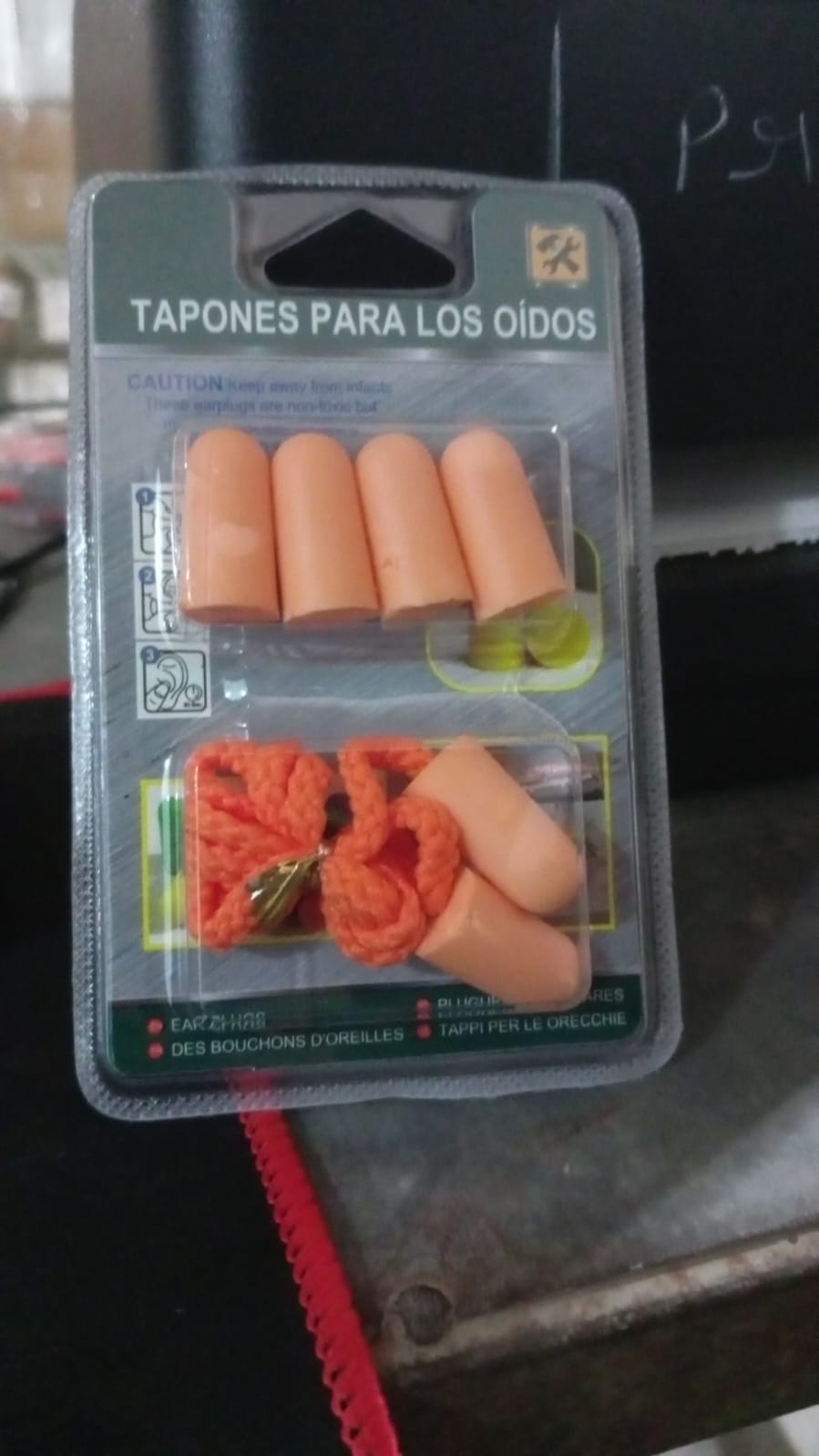 Comfortable soft foam earplugs displayed on a wooden table.