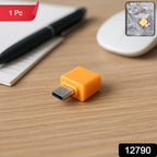 Compact Micro USB OTG Adapter shown next to a smartphone, highlighting its small size.
