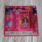 Another angle of the complete Barbie musical phone, watch, and glasses play set.