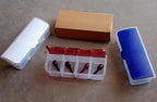 Multipurpose storage box holding dry fruits, spices, and pickles.