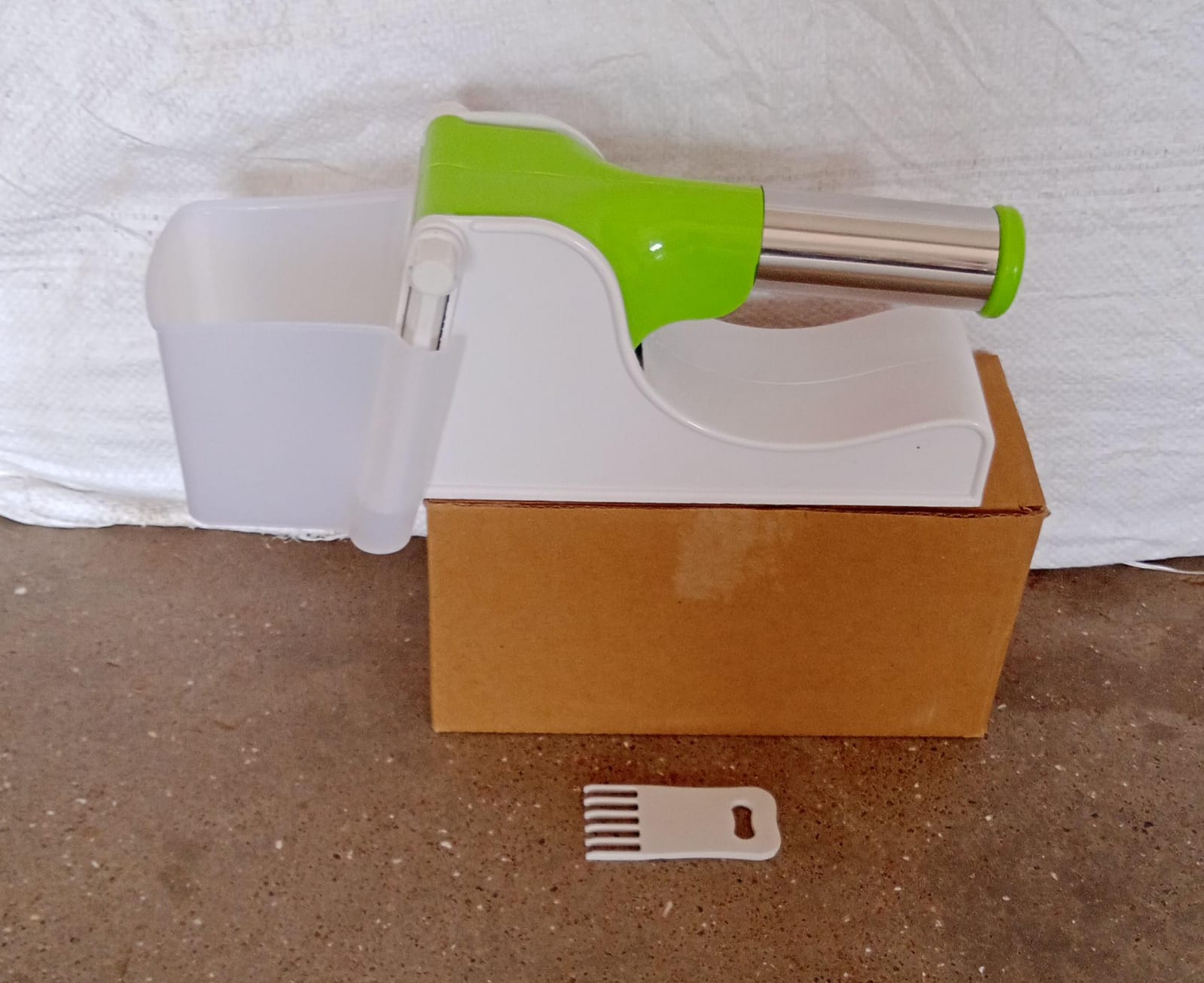 Ergonomic plastic potato slicer designed for safe and efficient use.