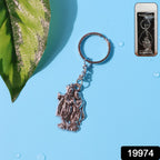 Close-up front view of Radha Krishna metal keychain with detailed motifs