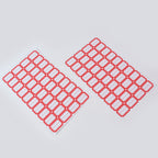 Hand writing on red border label sticker demonstrating its smooth writable surface.