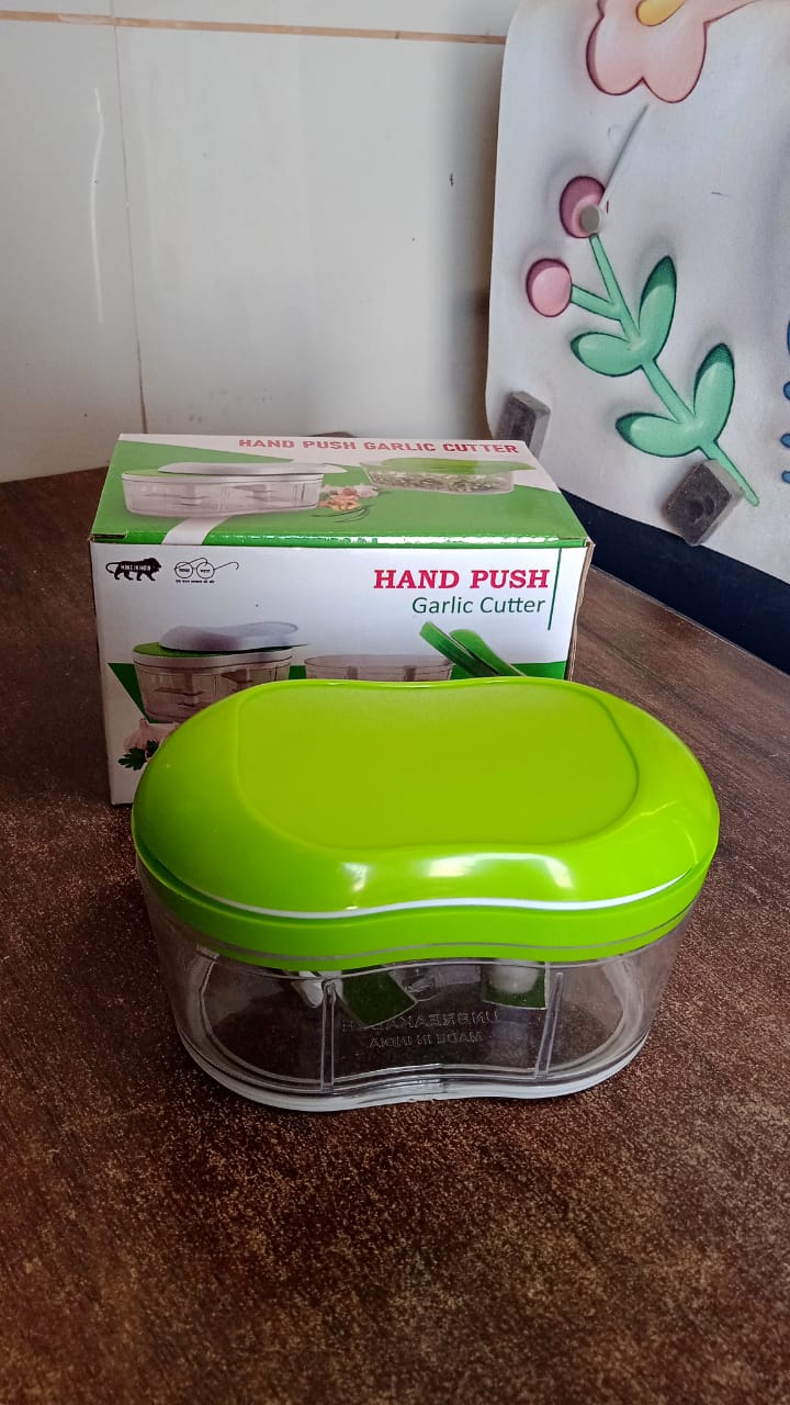 Manual hand push chopper on a kitchen countertop ready for use