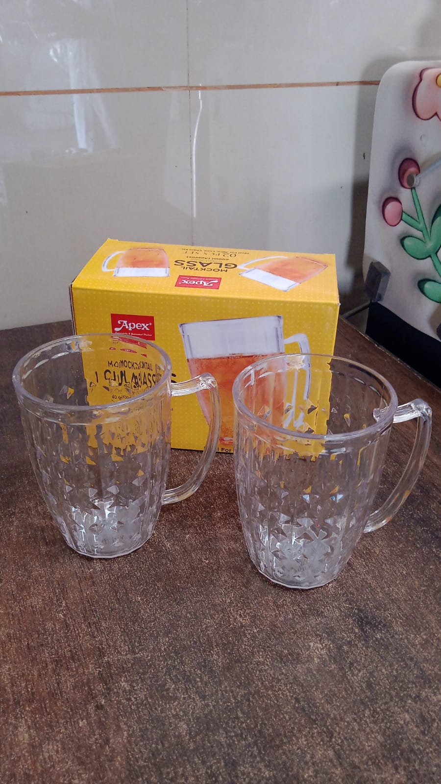 Brightly lit display of two acrylic Mocktail Mugs perfect for juices and lassi