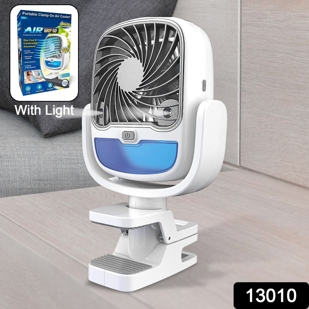Compact portable fan cooling a baby in a stroller, demonstrating outdoor use.
