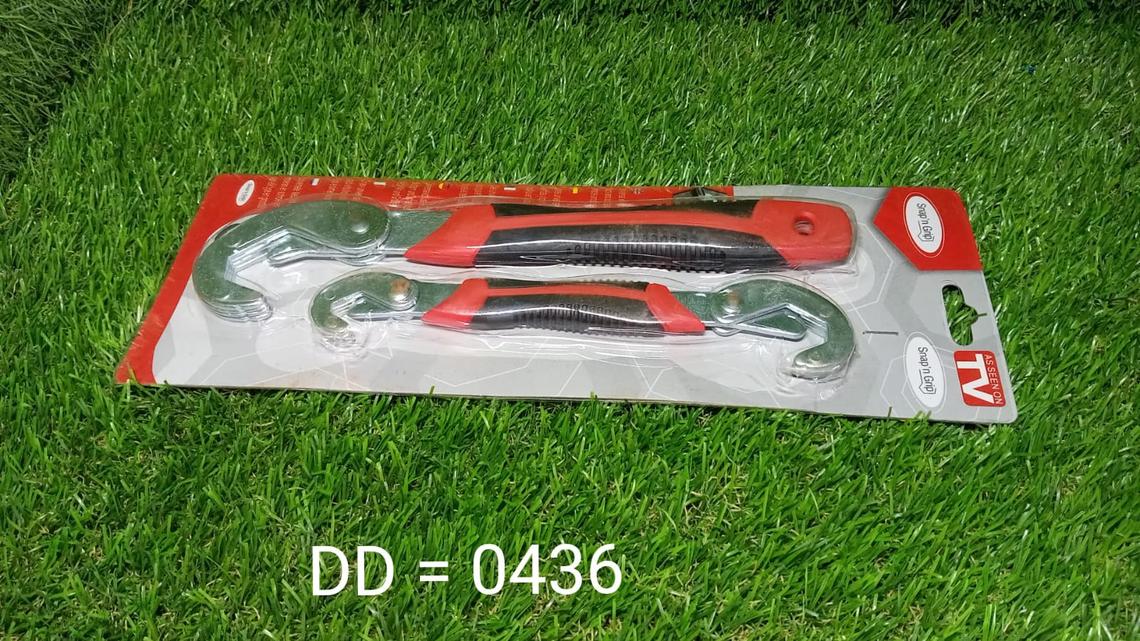 Angled view of the durable red and black Quick Snap N Grip adjustable wrench set.