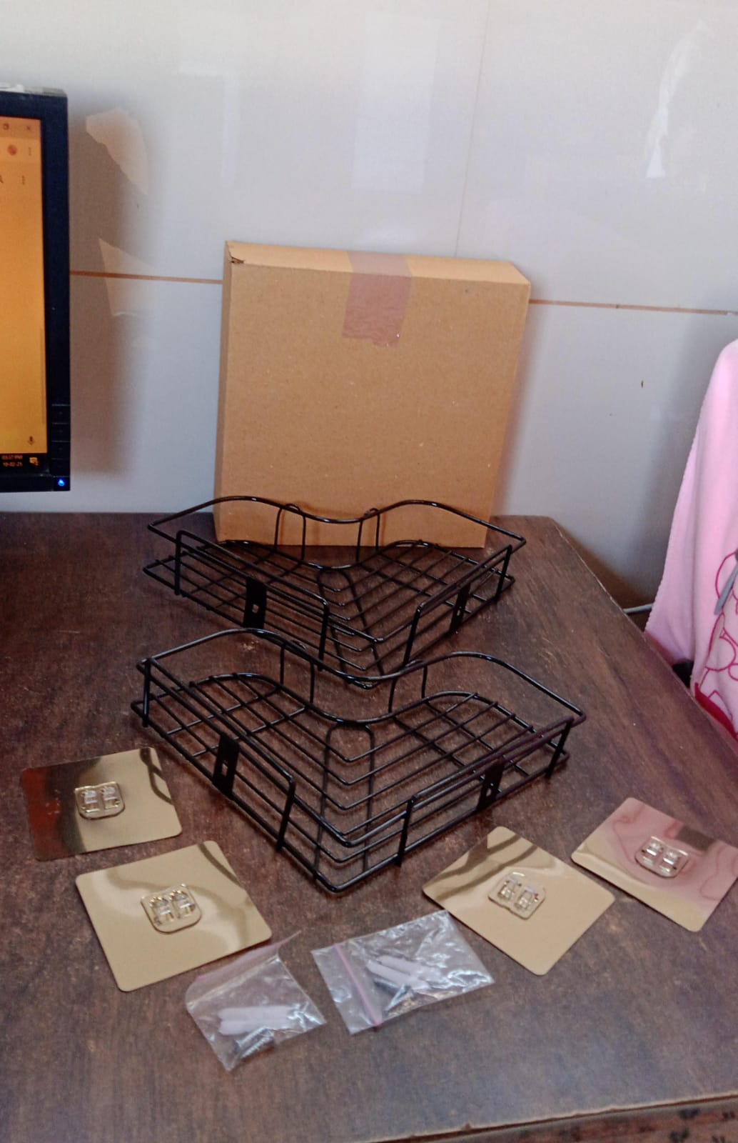 Detailed image showing metal corner shelf installation without drilling