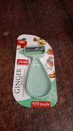 Side view of Apex ginger peeler with built-in grater for garlic and ginger