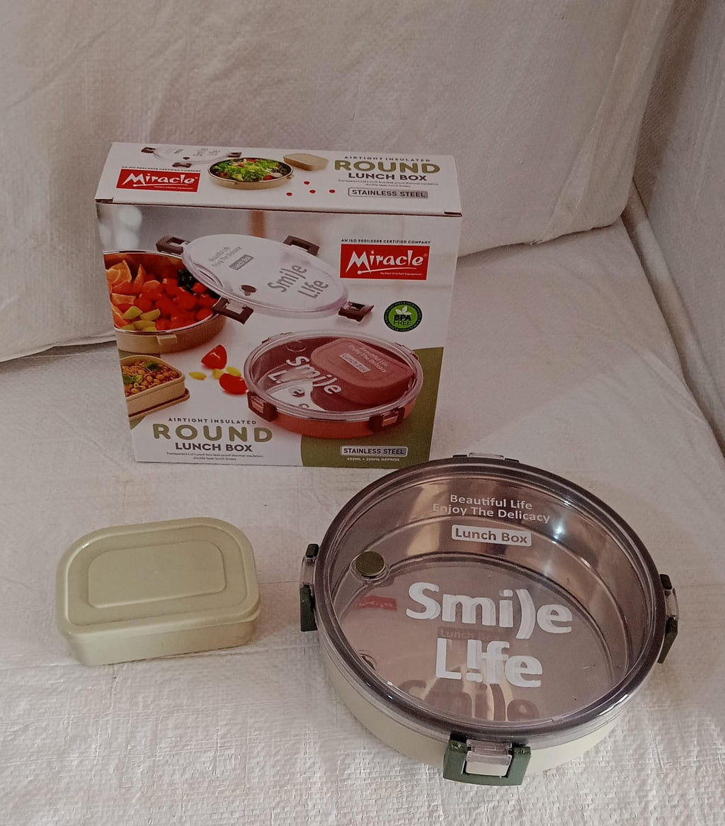 A different angle of the round Miracle Stainless Steel Lunch Box, highlighting its modern design.