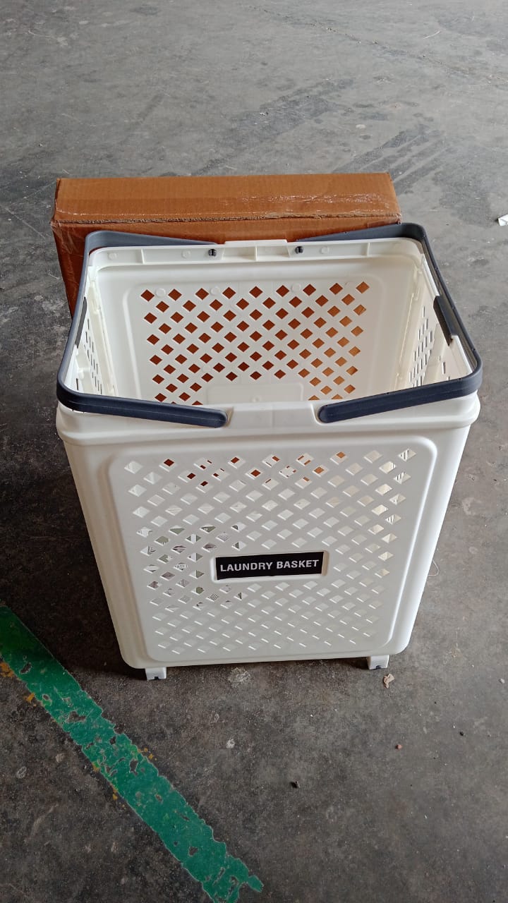 Folded state of large plastic laundry basket with wheels for compact storage