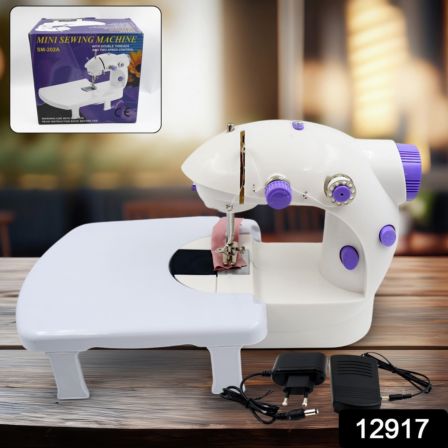 Woman using the portable electric silai machine for home tailoring on a desktop.