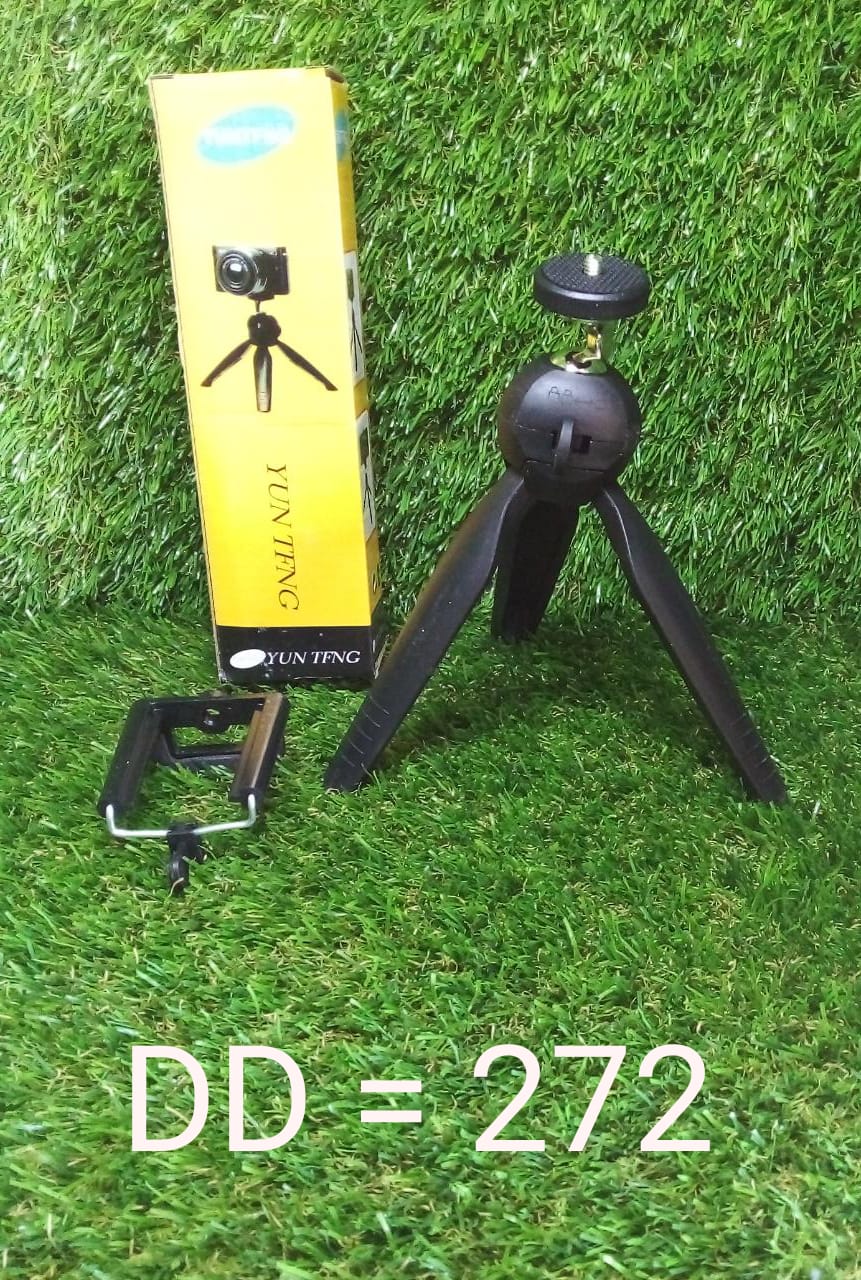 A mini tripod in use, capturing a steady shot with a digital camera.