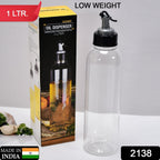 Ergonomic 1L oil dispenser with clear body and controlled pouring spout.