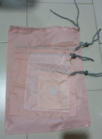 Folding nylon storage pouches for compact packing of various items.