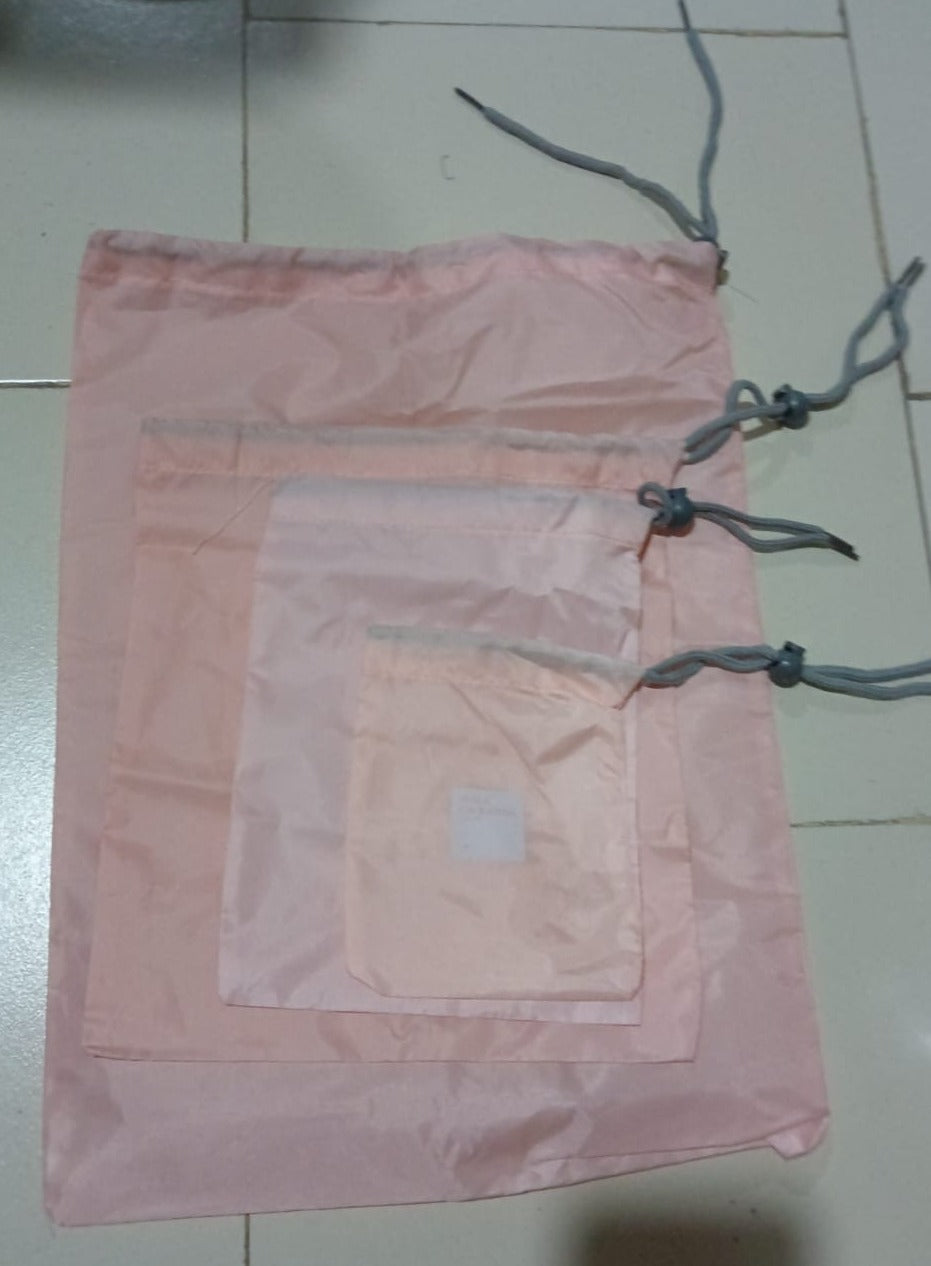 Folding nylon storage pouches for compact packing of various items.