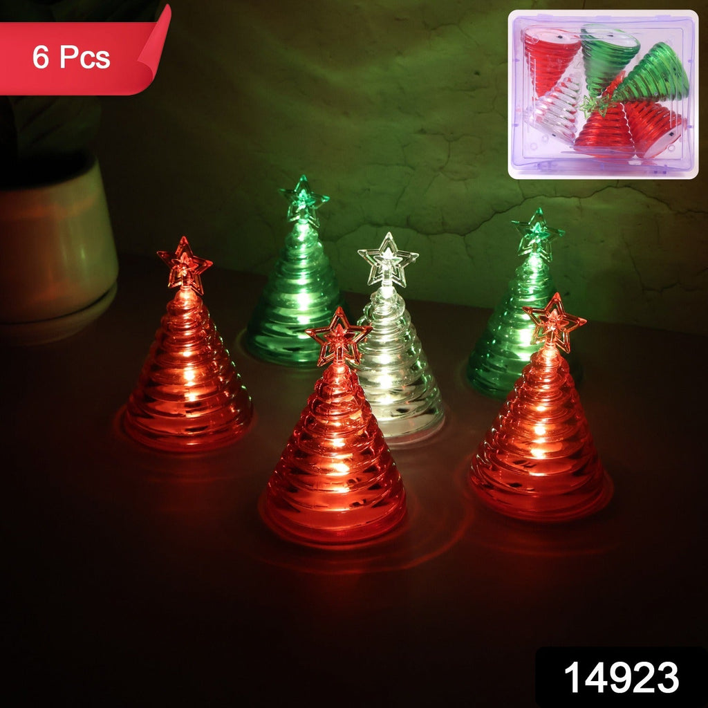 Mini battery operated LED Christmas tree lights in cone shape with glowing star tops
