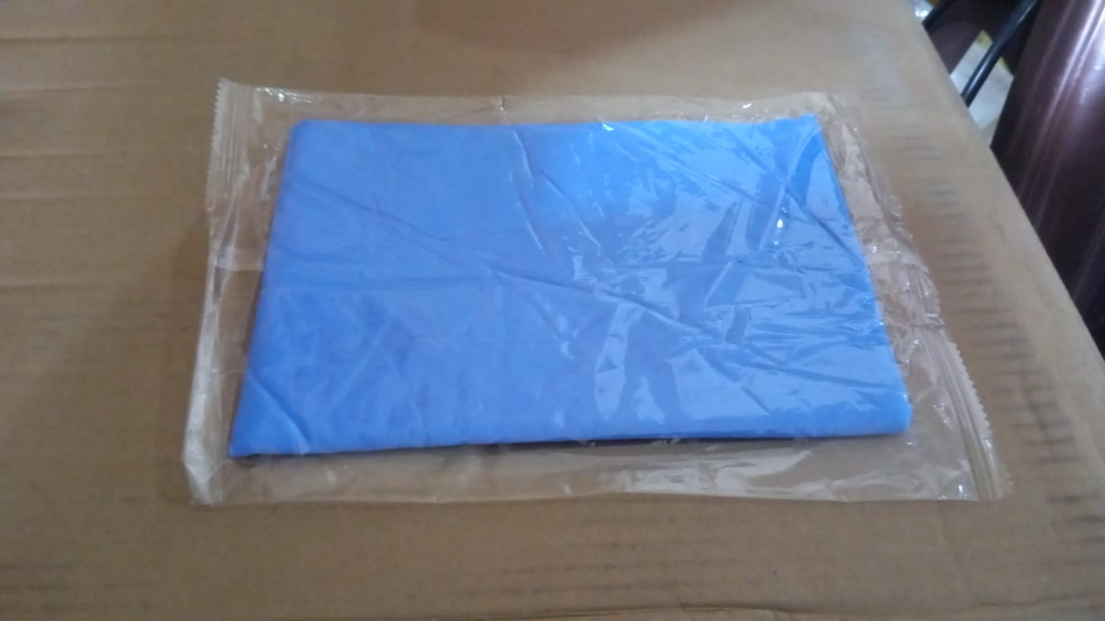 Magic Cleaning Towel absorbing liquid on a surface, demonstrating its super absorbent PVA properties.