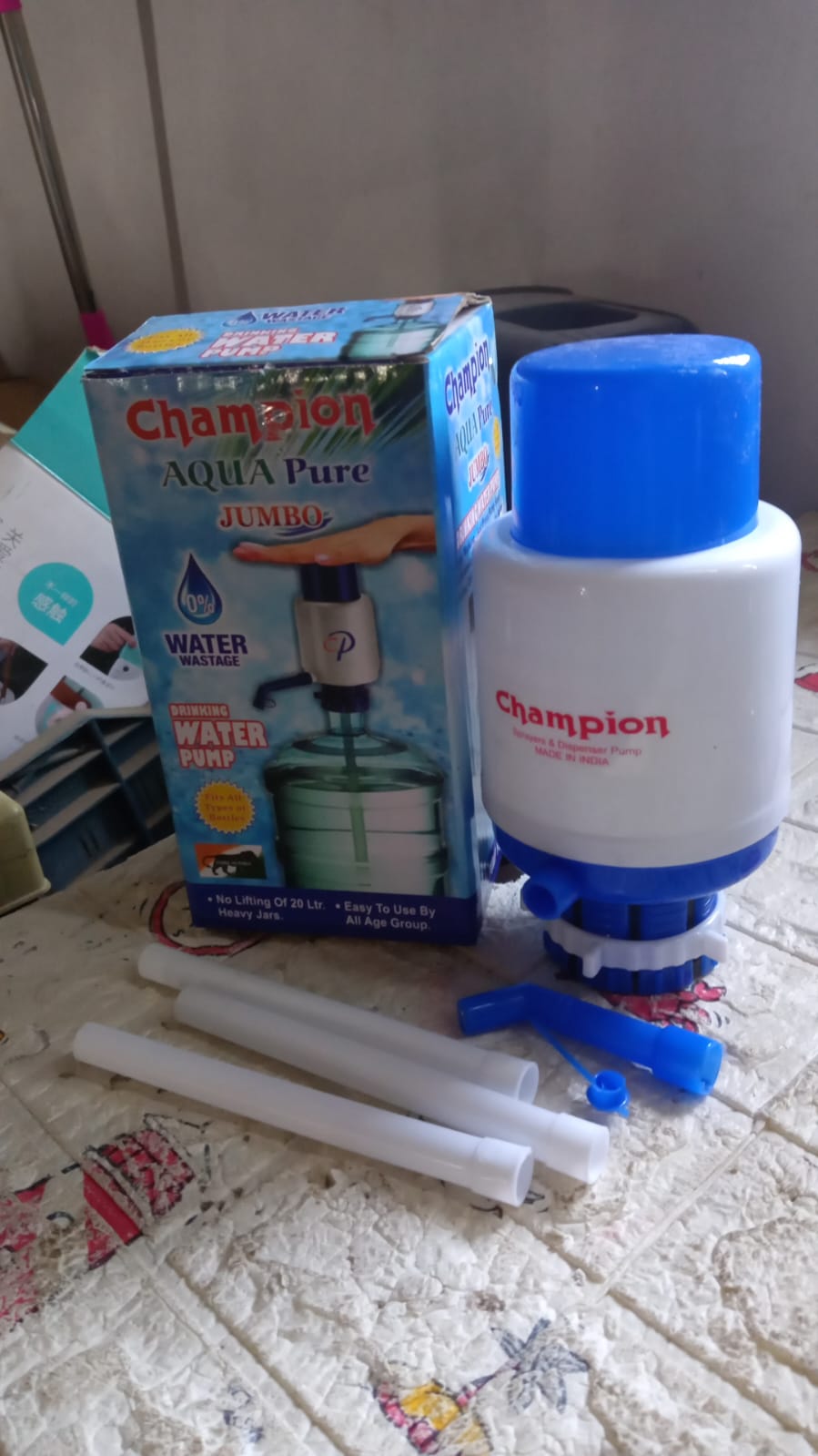 Versatile manual water hand press pump suitable for dispensing water from large bottles in home or office.