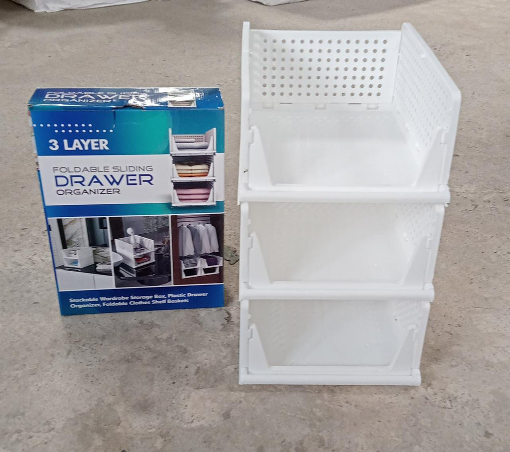 Stackable and foldable 3-layer clothes organizer, ideal for closet and drawer use.