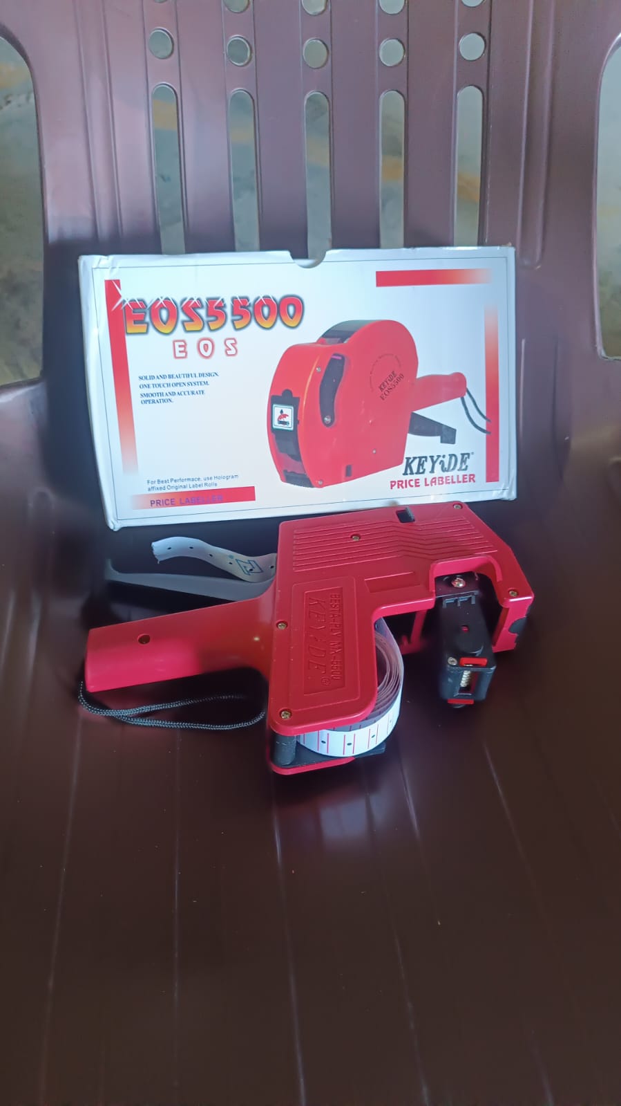 The 8-digit Price Tag Gun in its packaging, ready for use in a retail or market setting.