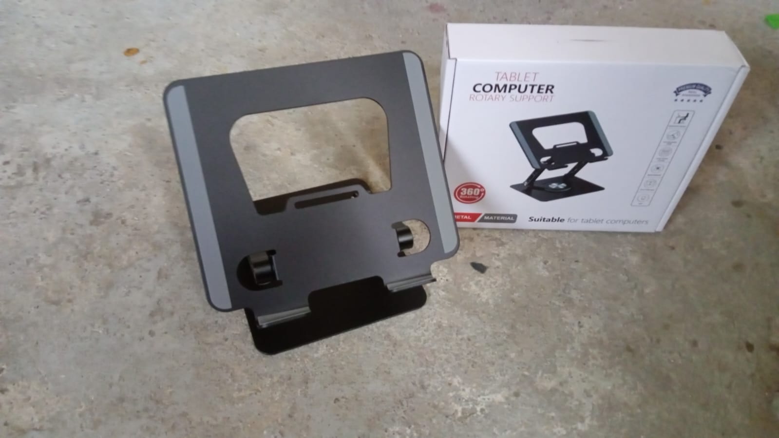 Compact size of the rotating laptop stand when folded, ideal for travel.