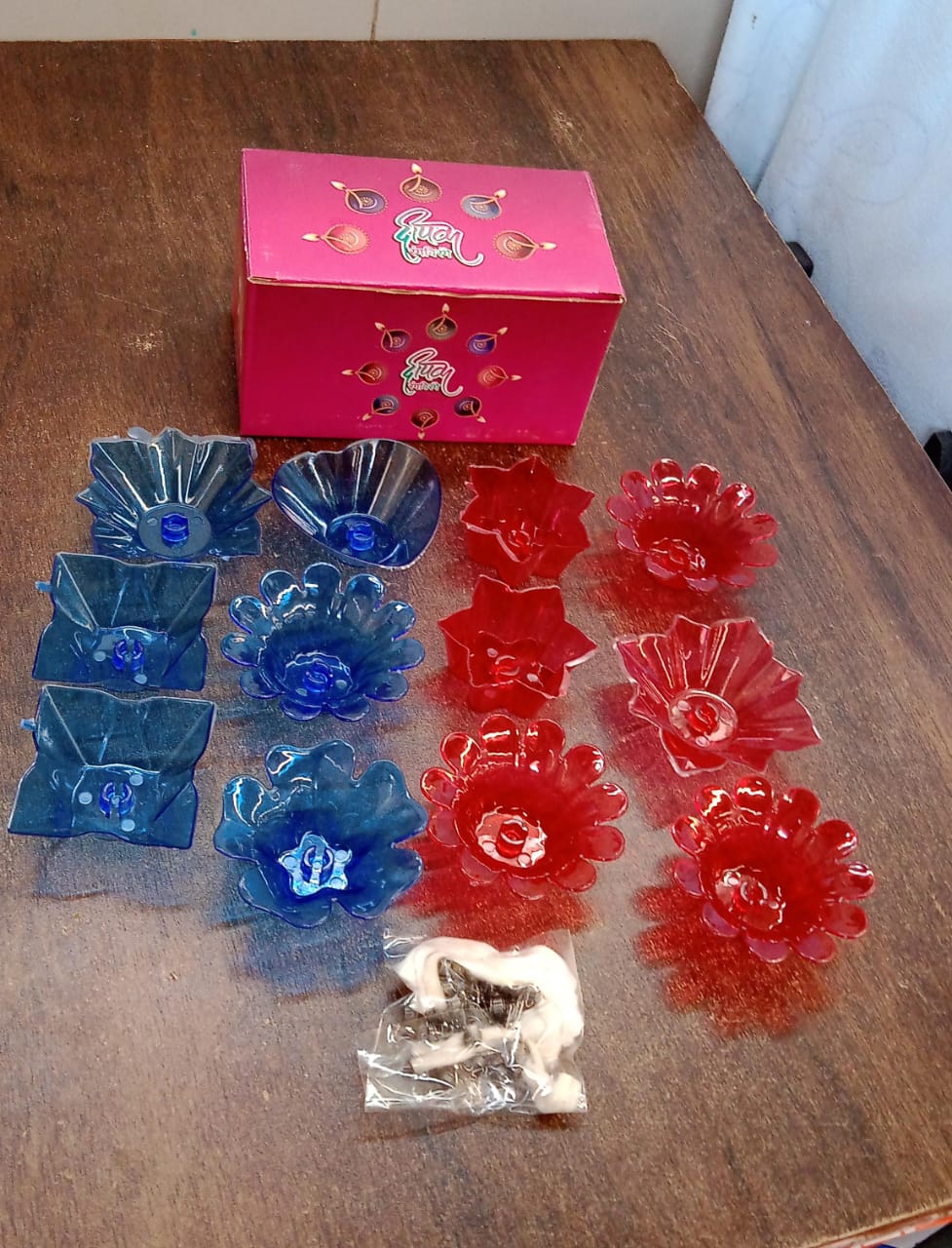 A collection of the plastic candle holders from the Indo Glow Diwali Diya Set.